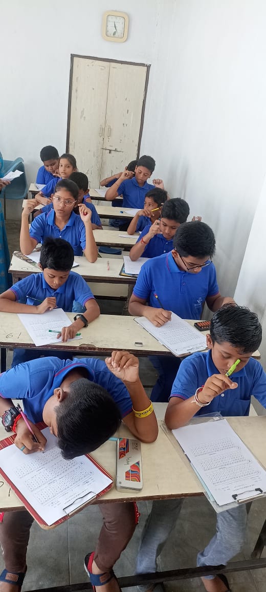 Children learning abacus in classroom